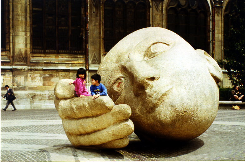 Children playing at a sculpture in Paris