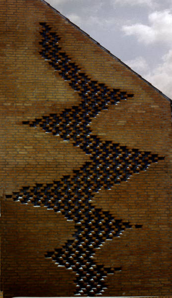 Gable wall with glazed and formed stone